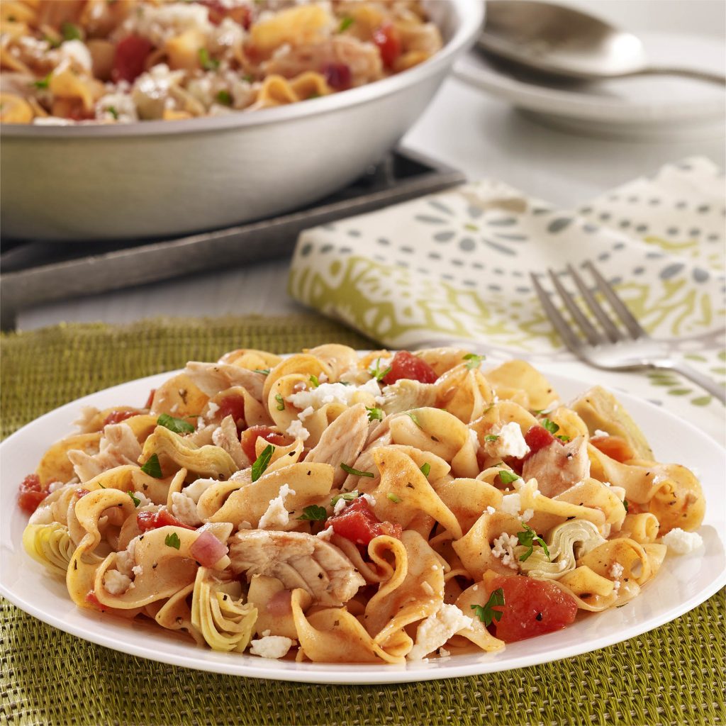 Egg noodles with tuna, artichokes, diced tomatoes, and feta cheese