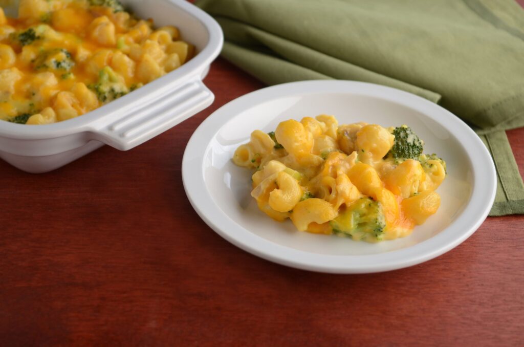 Elbows and broccoli coated in a cheese sauce, baked in a casserole dish